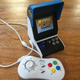 The Neo Geo Mini and its optional controller.